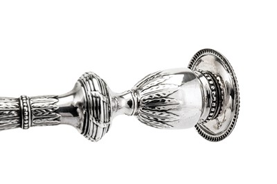 Lot 573 - A set of four George III sterling silver candlesticks, London 1778 by John Scofield (reg. 13th Jan 1778)