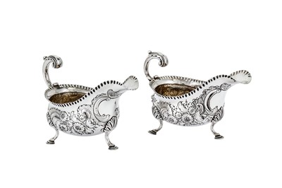 Lot 546 - A pair of early George III sterling silver sauceboats, London 1764 by William Skeen (reg. 4th Dec 1755)