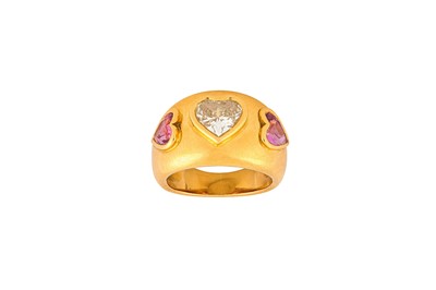 Lot 31 - A pink sapphire and diamond ring Centered by a...