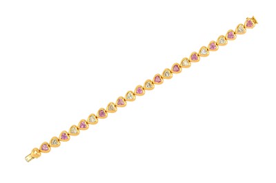 Lot 29 - A diamond and pink sapphire line bracelet The...