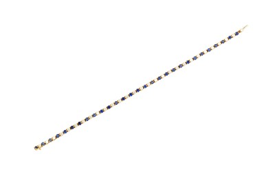 Lot 157 - A sapphire and diamond line bracelet, by...