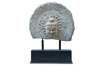 Lot 582 - A CHINESE STONE HEAD OF A BUDDHA. Carved with...