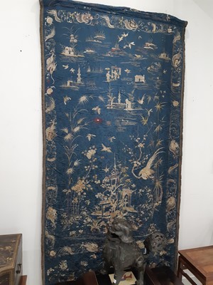 Lot 381 - A LARGE CHINESE BLUE-GROUND ‘FANTASTIC LANDSCAPE’ SILK EMBROIDERY PANEL.