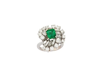 Lot 178 - An emerald and diamond cluster ring The...