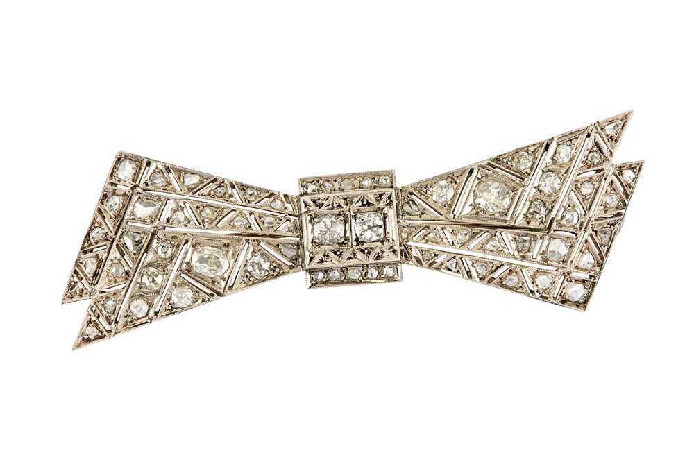 Lot 90 - A diamond bow brooch Of pierced geometric...