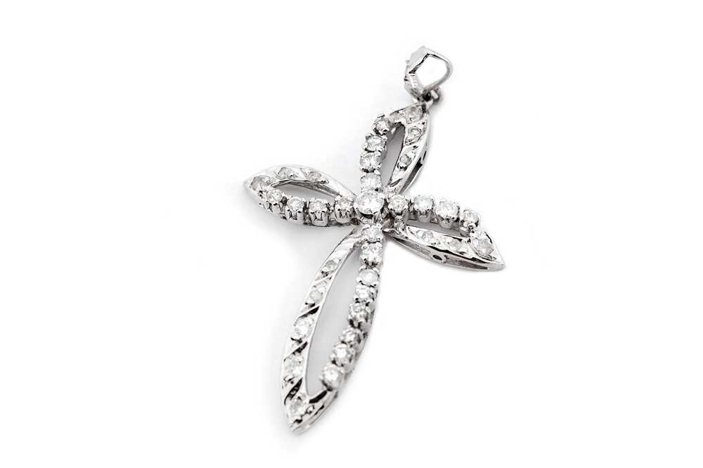 Lot 21 - A diamond cross pendant, of openwork design...