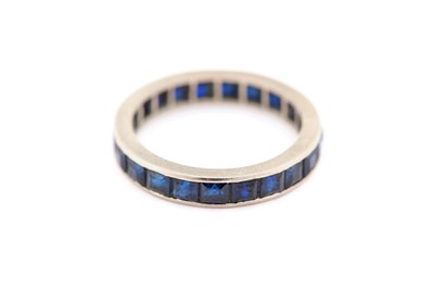 Lot 3 - A sapphire eternity ring, designed as a...