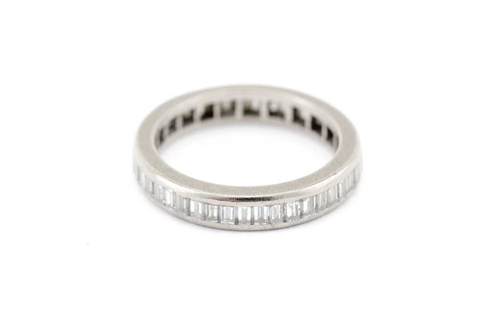 Lot 13 - A diamond eternity ring, channel-set with a...