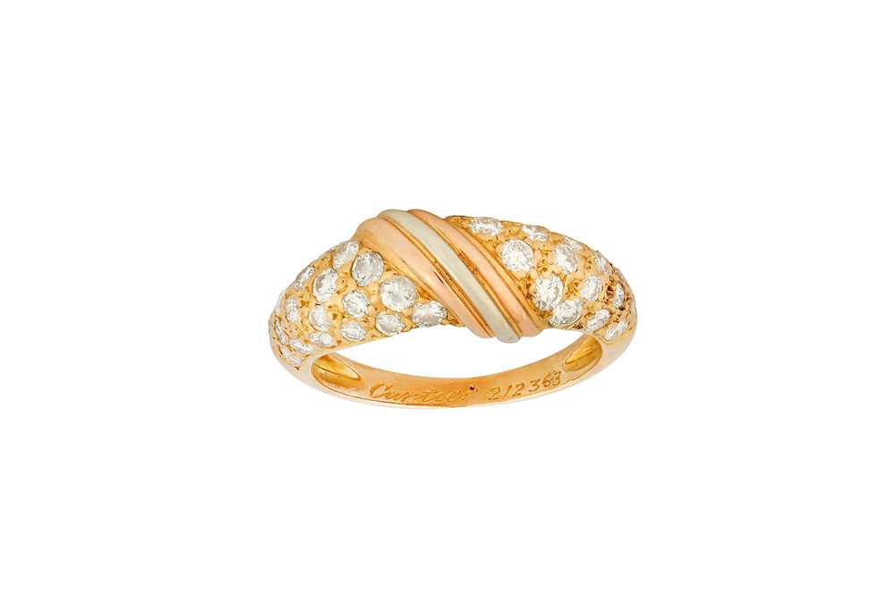Lot 166 - A diamond ring, by Cartier Featuring central...