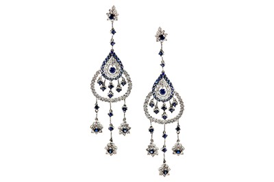 Lot 78 - A pair of sapphire and diamond pendent...