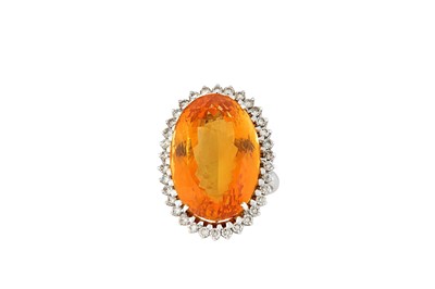 Lot 18 - A citrine and diamond cluster ring The...