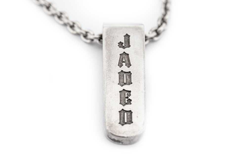 Lot 33 - A "JADED" silver pendant necklace, by Jade...