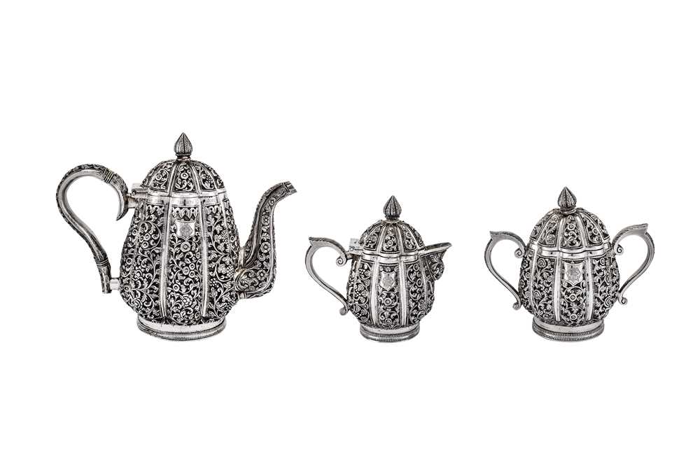 Lot 295 - An early 20th century Anglo-Indian Raj unmarked silver three-piece tea set, Karachi circa 1911