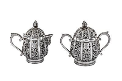 Lot 295 - An early 20th century Anglo-Indian Raj unmarked silver three-piece tea set, Karachi circa 1911