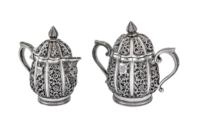 Lot 295 - An early 20th century Anglo-Indian Raj unmarked silver three-piece tea set, Karachi circa 1911