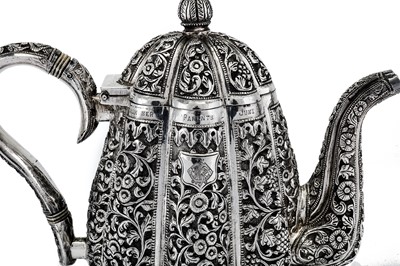 Lot 295 - An early 20th century Anglo-Indian Raj unmarked silver three-piece tea set, Karachi circa 1911