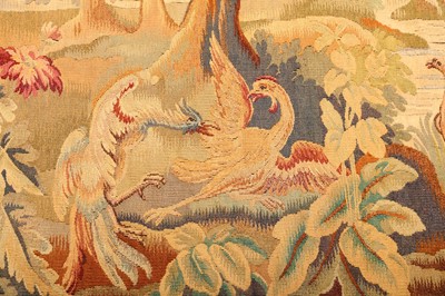 Lot 74 - A 19TH CENTURY VERDURE TAPESTRY DEPICTING A...