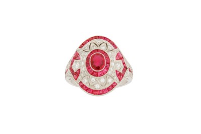 Lot 134 - A ruby and diamond dress ring The oval-cut...