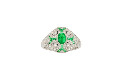 Lot 180 - An emerald and diamond dress ring The oval-cut...