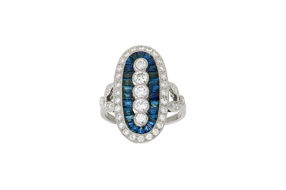 Lot 83 - A sapphire and diamond dress ring The oval...