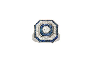 Lot 85 - A sapphire and diamond cluster ring The...