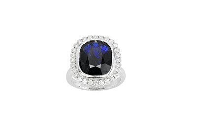 Lot 88 - A sapphire and diamond ring The cushion-shaped,...