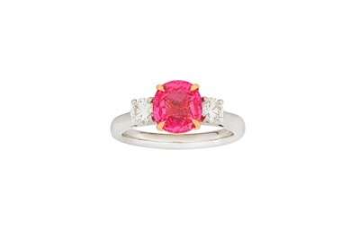 Lot 131 - A pink sapphire and diamond three-stone ring...