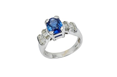 Lot 86 - A sapphire and diamond ring The oval-cut...