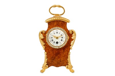 Lot 217 - A late 19th/early 20th century French burr walnut, gilt
bronze mounted and paste set boudoir clock