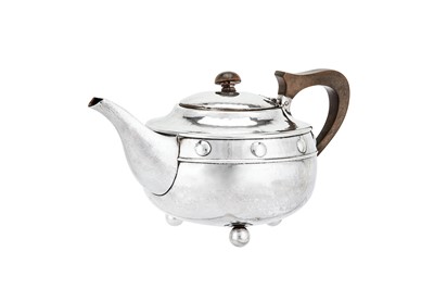Lot 526 - A George V sterling silver ‘arts and crafts’ teapot, Birmingham 1923 by A. E. Jones