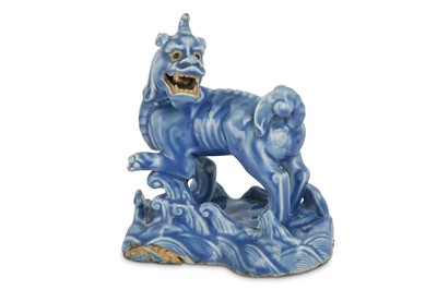 Lot 339 - A CHINESE BLUE-GLAZED BISCUIT MODEL OF A QILIN  AND A PAIR OF PURPLE-GLAZED ANIMALS.