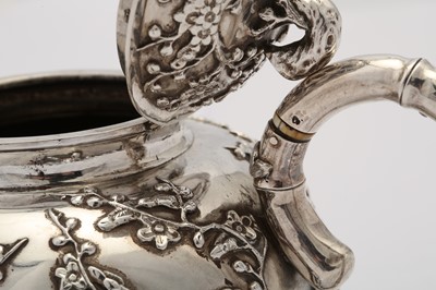 Lot 249 - An early 20th century Chinese export silver three-piece tea service, Shanghai circa 1910 retailed by Luen Hing