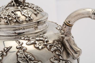 Lot 249 - An early 20th century Chinese export silver three-piece tea service, Shanghai circa 1910 retailed by Luen Hing