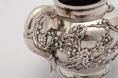 Lot 249 - An early 20th century Chinese export silver three-piece tea service, Shanghai circa 1910 retailed by Luen Hing
