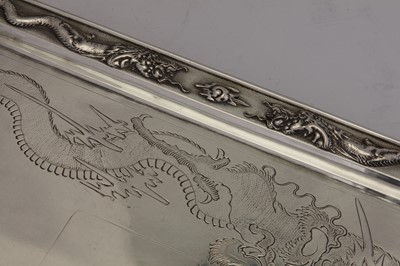 Lot 168 - An early 20th century Chinese Export silver twin handled tray, Hong Kong circa 1930 retailed by Wing On & Co