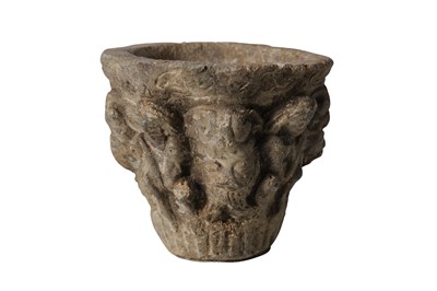 Lot 9 - AN EARLY MEDIEVAL CARVED STONE MORTAR OR VESSEL DECORATED WITH GROTESQUES