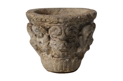 Lot 9 - AN EARLY MEDIEVAL CARVED STONE MORTAR OR VESSEL DECORATED WITH GROTESQUES
