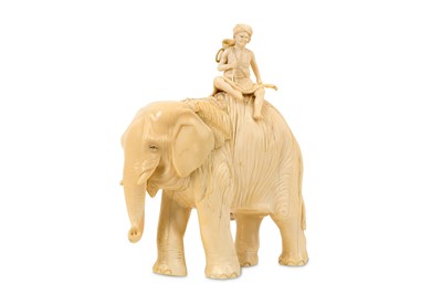 Lot 142 - AMENDED - AN EARLY 20TH CENTURY JAPANESE CARVED IVORY OKIMONO OF AN ELEPHANT AND RIDER