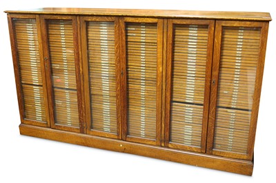 Lot 489 - Baird & Tatlock (London) Ltd: An early 20th Century oak collectors cabinet