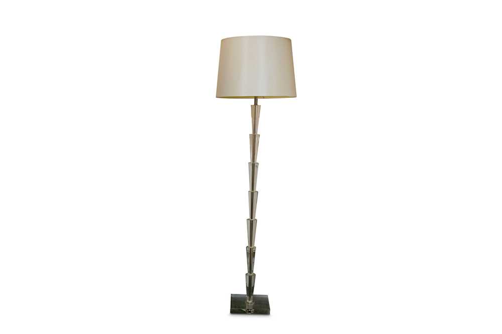 Lot 337 - A contemporary glass standard lamp, the stem