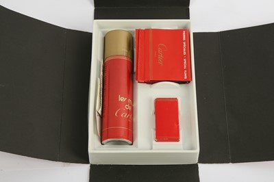 Lot 142 - A Cartier gold plated lighter, number 08861B...