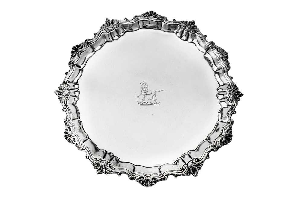 Lot 497 - A George II sterling silver salver, London 1748 by John Robertson II (reg. 3rd July 1739), also later stamped for Thomas Hemming (Grimwade 3828)
