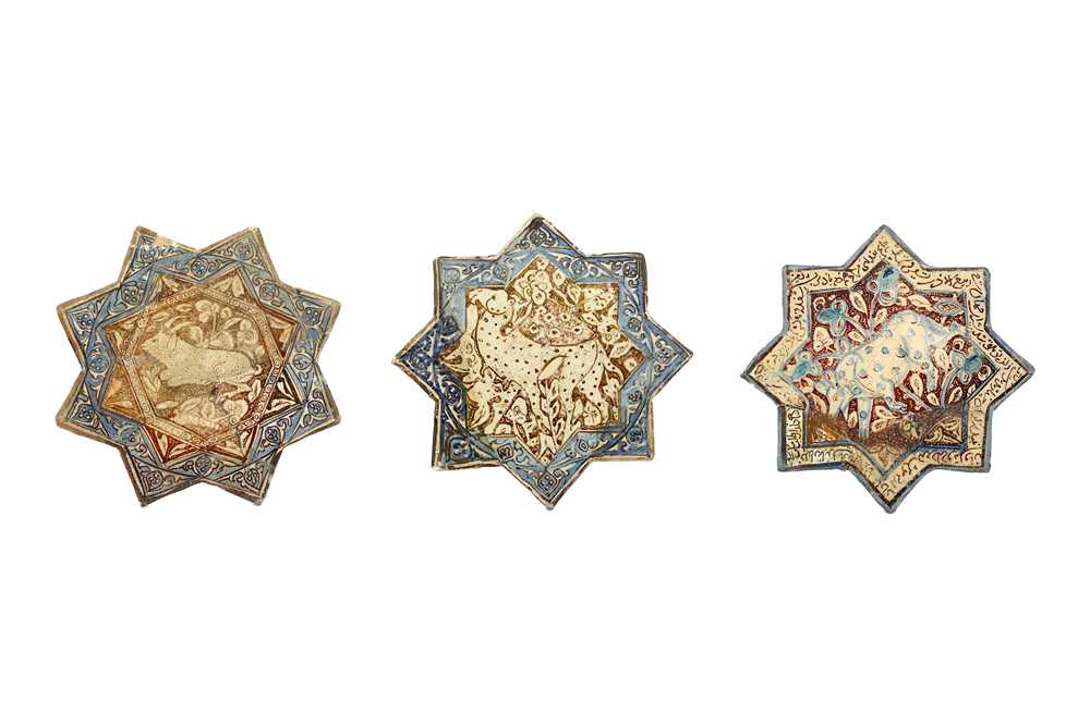 Lot 2 - THREE COBALT BLUE AND LUSTRE-PAINTED STAR POTTERY TILES PROPERTY OF THE LATE BRUNO CARUSO (1927 - 2018) COLLECTION