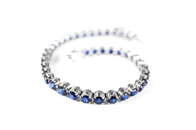 Lot 49 - A sapphire line bracelet