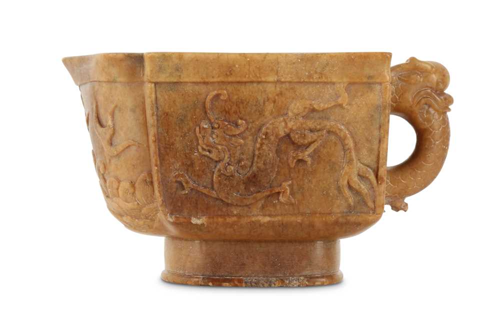 Lot 68 - A CHINESE SOAPSTONE ARCHAISTIC 'DRAGON' POURING VESSEL.