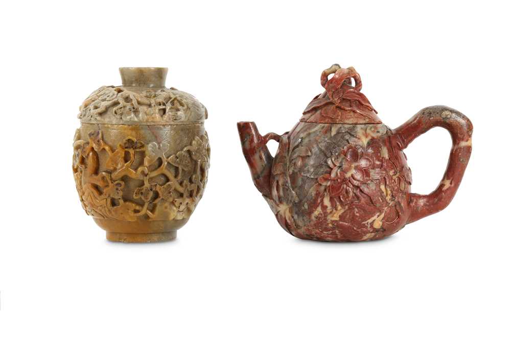 Lot 66 - A CHINESE SOAPSTONE 'MAGNOLIA' TEAPOT AND COVER AND A SOAPSTONE 'GRAPEVINE' CUP AND COVER.