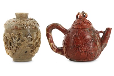 Lot 66 - A CHINESE SOAPSTONE 'MAGNOLIA' TEAPOT AND COVER AND A SOAPSTONE 'GRAPEVINE' CUP AND COVER.