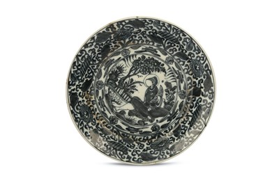 Lot 298 - *A BLUE AND WHITE POTTERY DISH WITH CHINESE-INSPIRED BORDERS