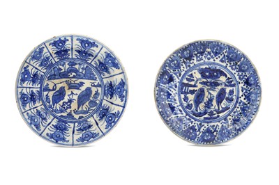 Lot 186 - *A NEAR PAIR OF CHINESE-INSPIRED BLUE AND WHITE POTTERY DISHES