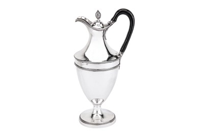 Lot 566 - A George III sterling silver wine ewer or hot water pot, London 1779 by Hester Bateman